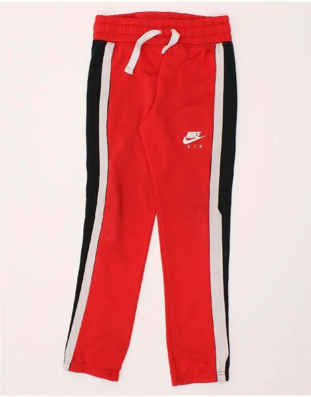NIKE Boys Tracksuit Trousers 10-11 Years Medium Red Colourblock Polyester